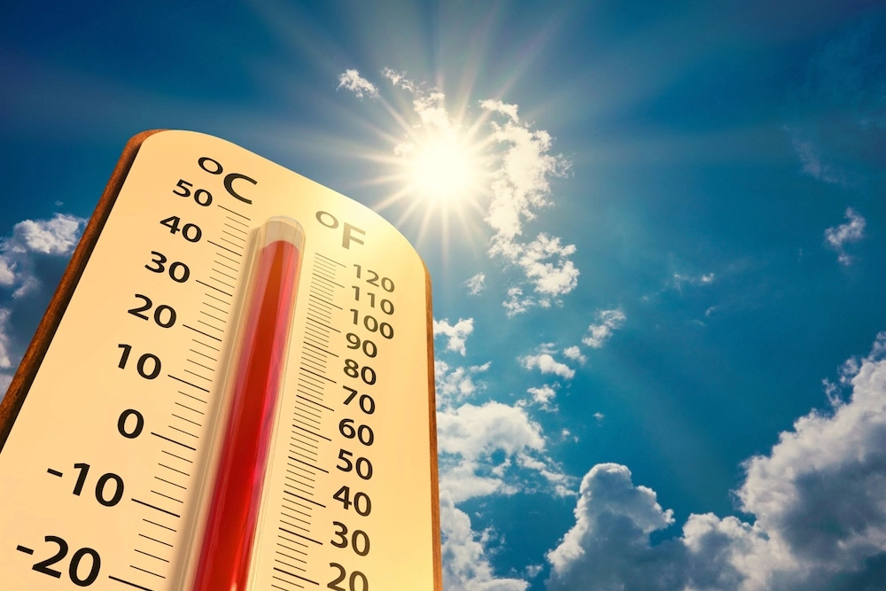 Hot thermometer outside in the summer heat